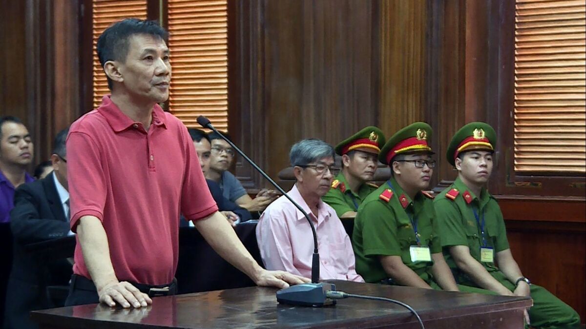 U.S. citizen Michael Nguyen stands trial Monday in a Ho Chi Minh City courtroom. The married Orange County father was sentenced to 12 years for "attempting to overthrow the state."