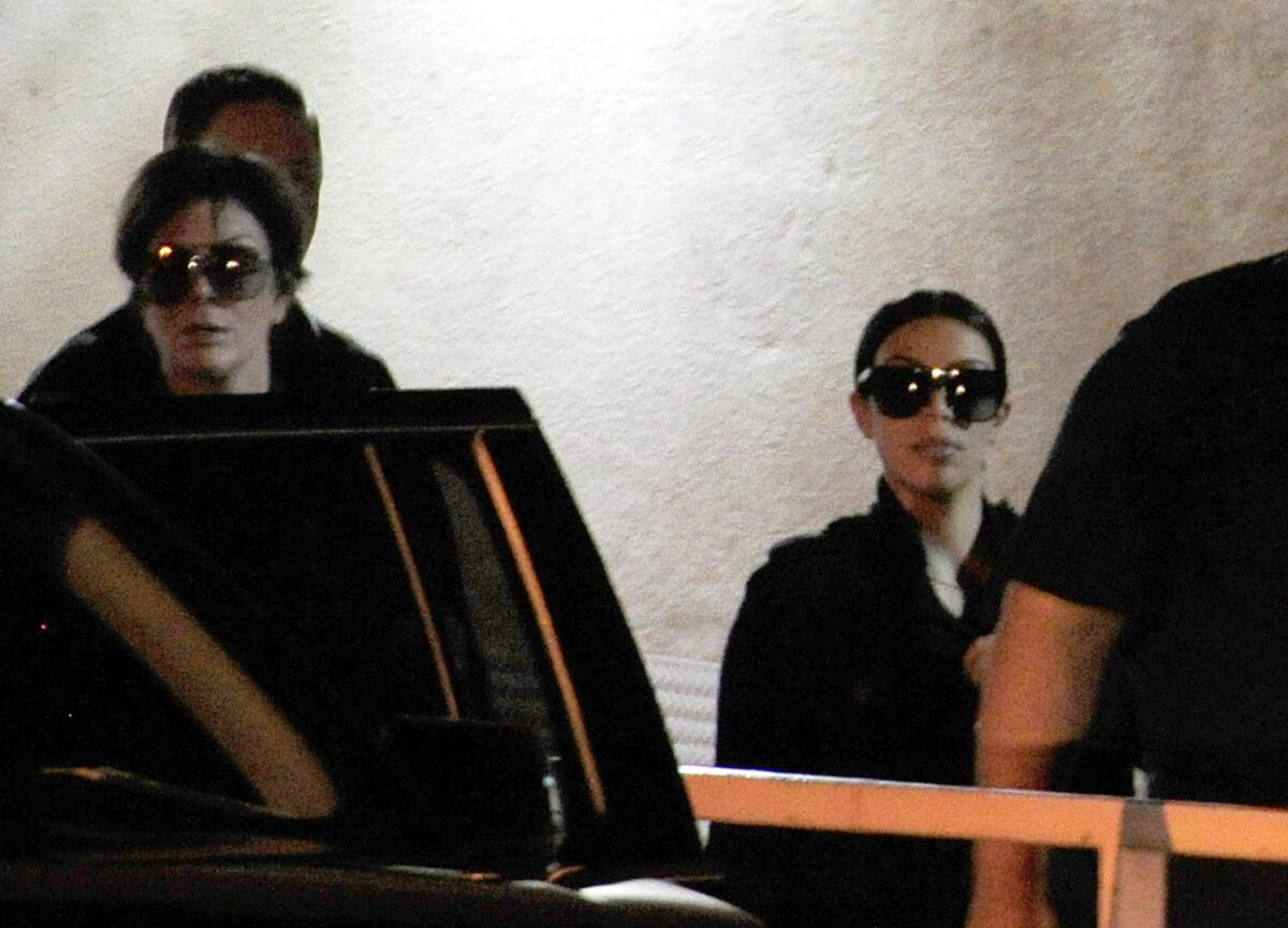 Television personalities Kris Jenner, left, and Kim Kardashian on Wednesday leave the Las Vegas hospital where former NBA player Lamar Odom is being treated.