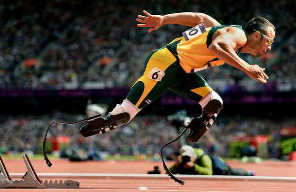 South Africa's Oscar Pistorius, aka the 'Blade Runner' because of his carbon-fiber prosthetics, takes off from the starting blocks in the first round of heats for the 400-meter race at the London Olympics on Saturday.