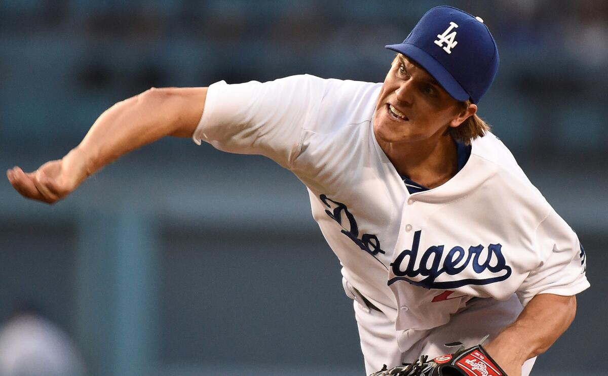 Dodgers starter Zack Greinke delivers a pitch against the Atlanta Braves on July 30. Greinke will not pitch Thursday because of soreness in his elbow.
