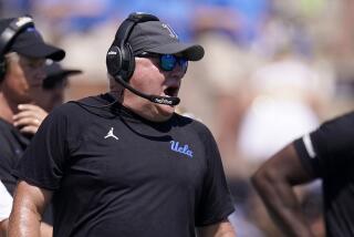 UCLA head coach Chip Kelly watches from the sideline during the second half.