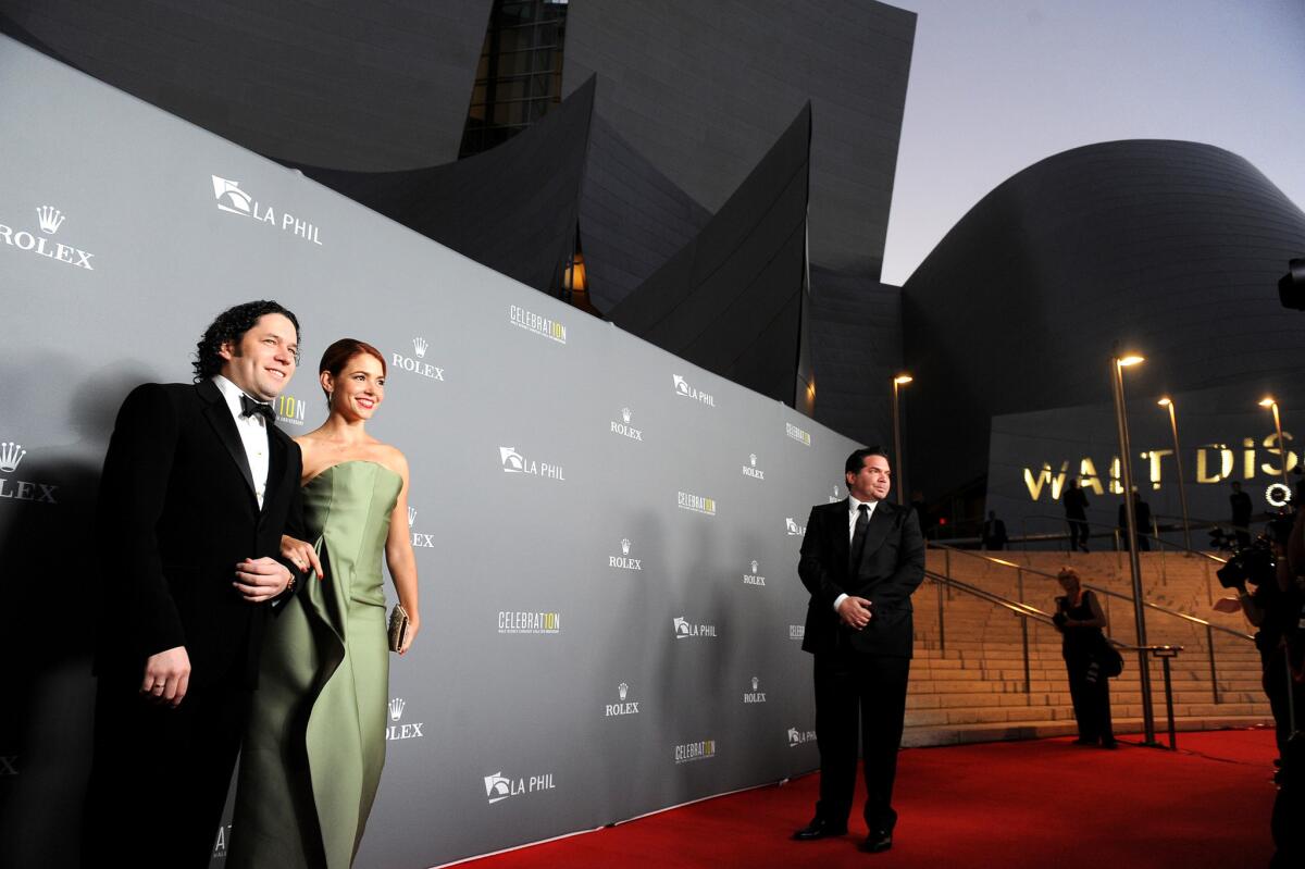 Gustavo Dudamel and his wife, Eloisa Maturen, shown in 2013 outside Disney Hall, are collaborating on the play "Death and the Maiden," set for the fall.