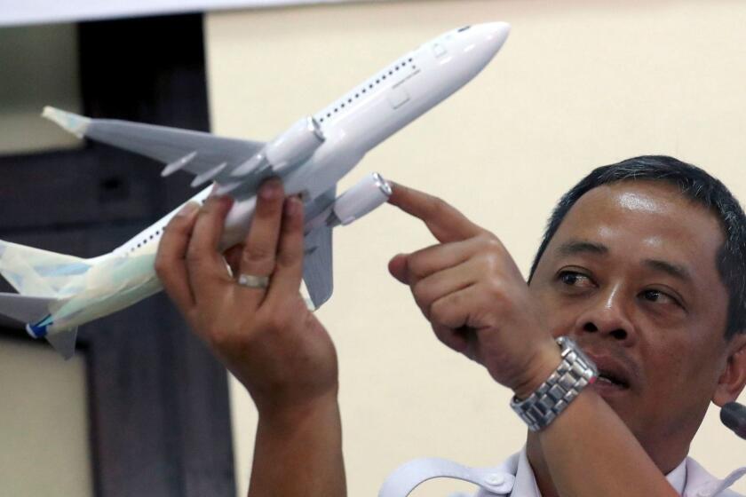 Mandatory Credit: Photo by BAGUS INDAHONO/EPA-EFE/REX (9998731a) The Indonesian National Transportation Safety Committee (KNKT) investigator, Nurcahyo Utomo, holds a Boing 737 aircraft model as he answers questions from journalists during a press conference in Jakarta, Indonesia, 28 November 2018. Lion Air flight JT-610 lost contact with air traffic controllers soon after takeoff on 29 October before crashing into the Sea. The flight was en route to Pangkal Pinang and reportedly had 189 people onboard. Lion Air flight JT-610 press conference in Jakarta, Indonesia - 28 Nov 2018 ** Usable by LA, CT and MoD ONLY **