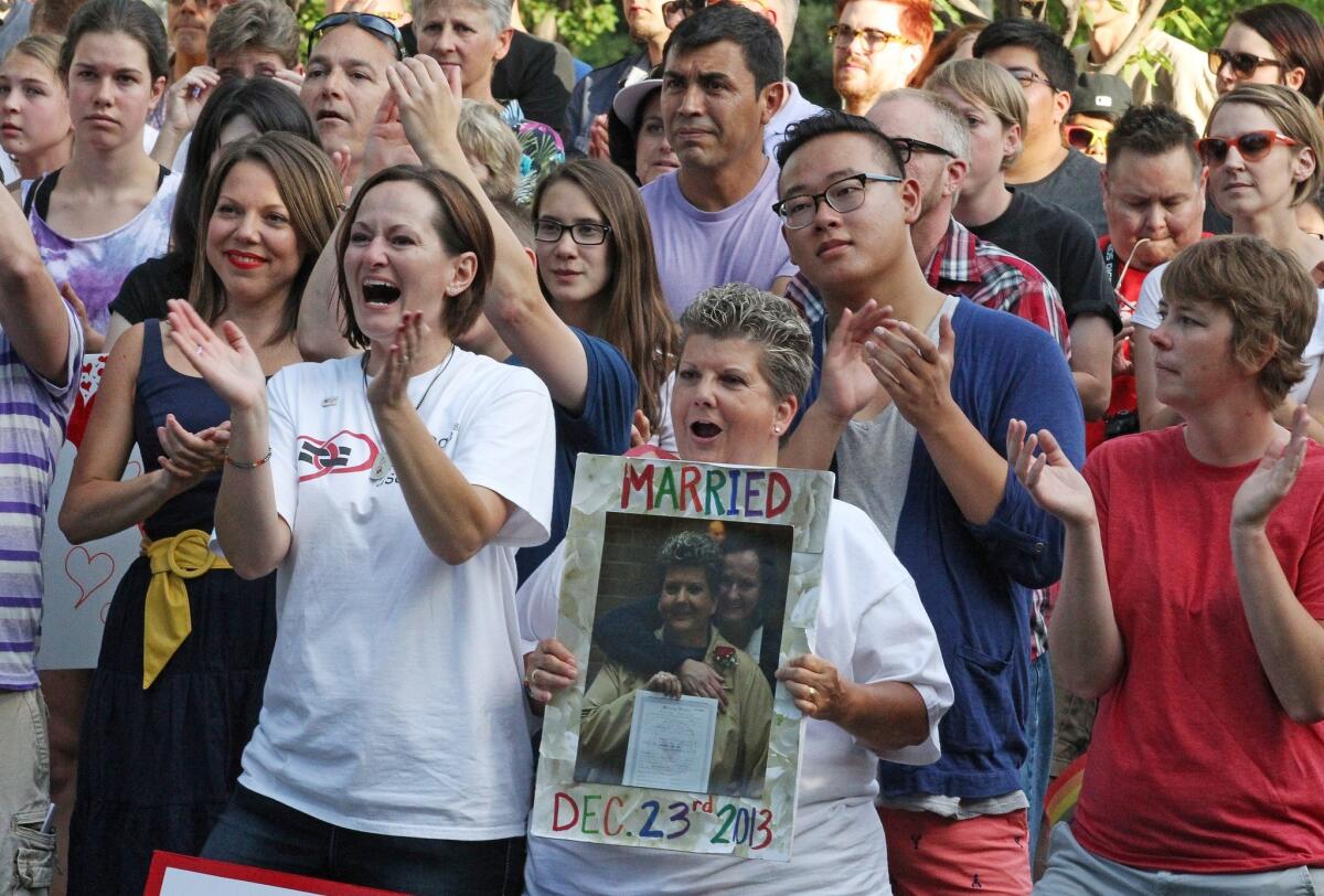 Several hundred people gather in Salt Lake City in June 2014 to celebrate a court ruling in favor of gay marriage in Utah. Nine states, including Utah, have joined the Indiana attorney generals appeal of lower court rulings that found bans on same-sex marriage unconstitutional.