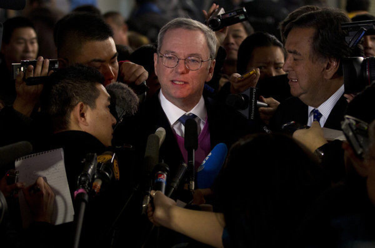 Google Executive Chairman Eric Schmidt, center, and former New Mexico governor Bill Richardson brief journalists after they arrived at Beijing Capital International Airport from North Korea on Thursday.