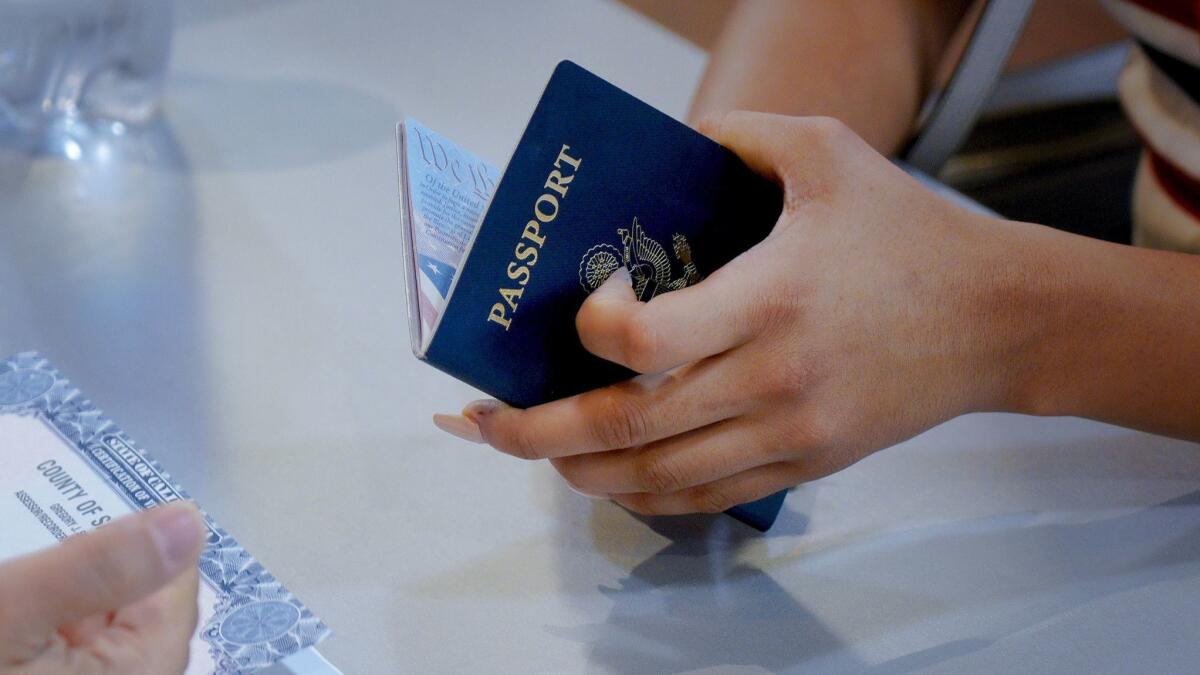 Preparing for a future trip to Europe, Amaya Torres applies for her passport renewal at the library in Chula Vista located at the Otay Ranch Town Center.