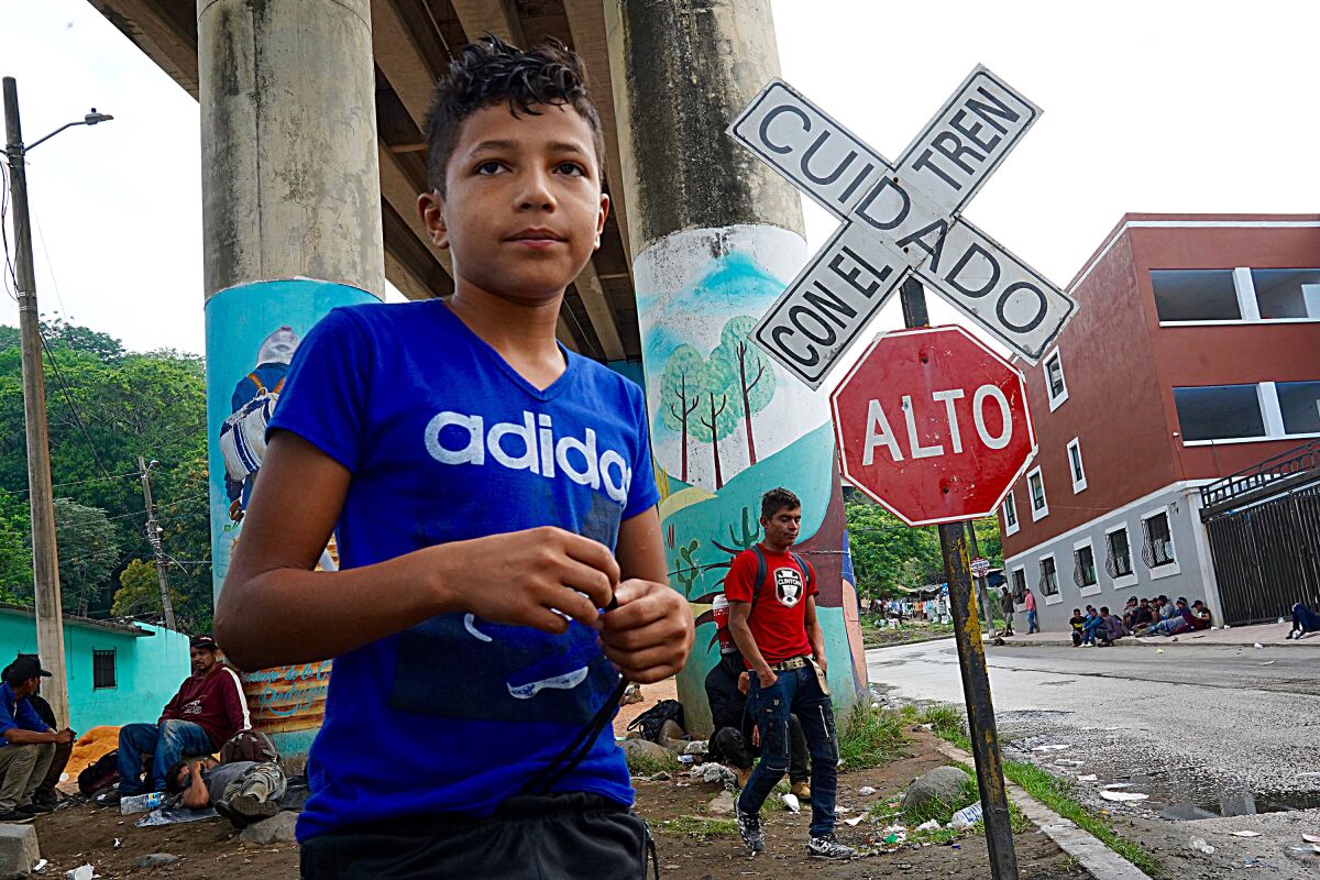 A boy alongside the train tracks in Coatzacoalcos in Veracruz state