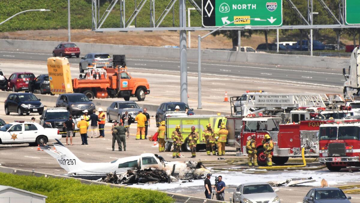 NEWPORT BEACH, CALIFORNIA JUNE 30, 2017-A small plane sits on the 405 Southbound freeway after crash just short of the John Wayne Aiport runway. (Wally Skalij/Los Angeles Times)