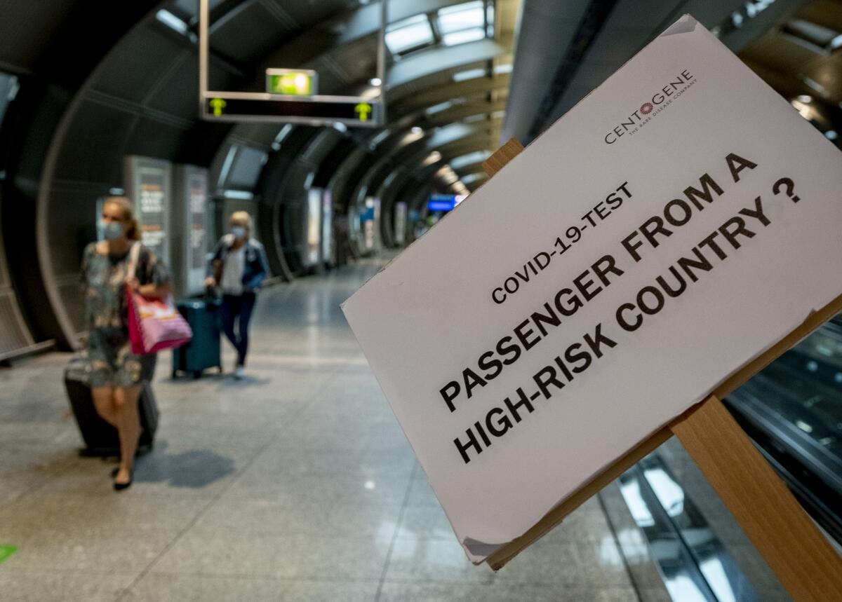 A sign helps passengers to find the Covid-19 test center at the airport in Frankfurt, Germany.