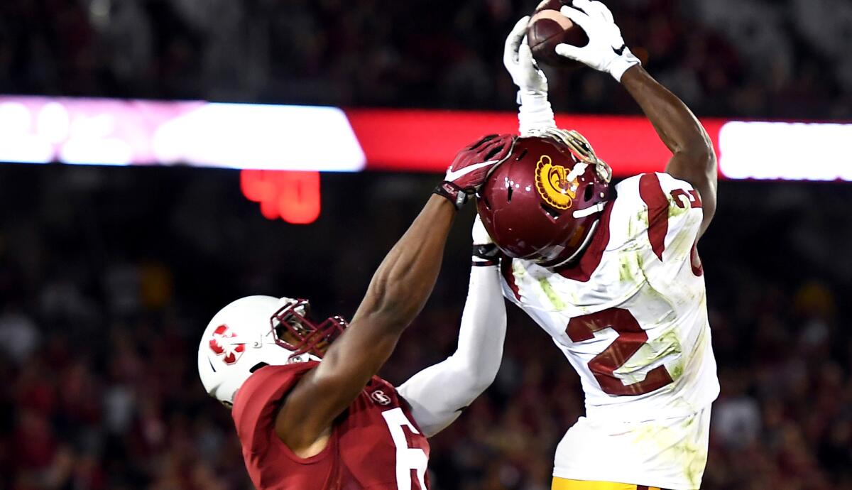 USC cornerback Adoree' Jackson intercepts a pass intended for Stanford receiver Francis Owusu in the fourth quarter on Saturday.