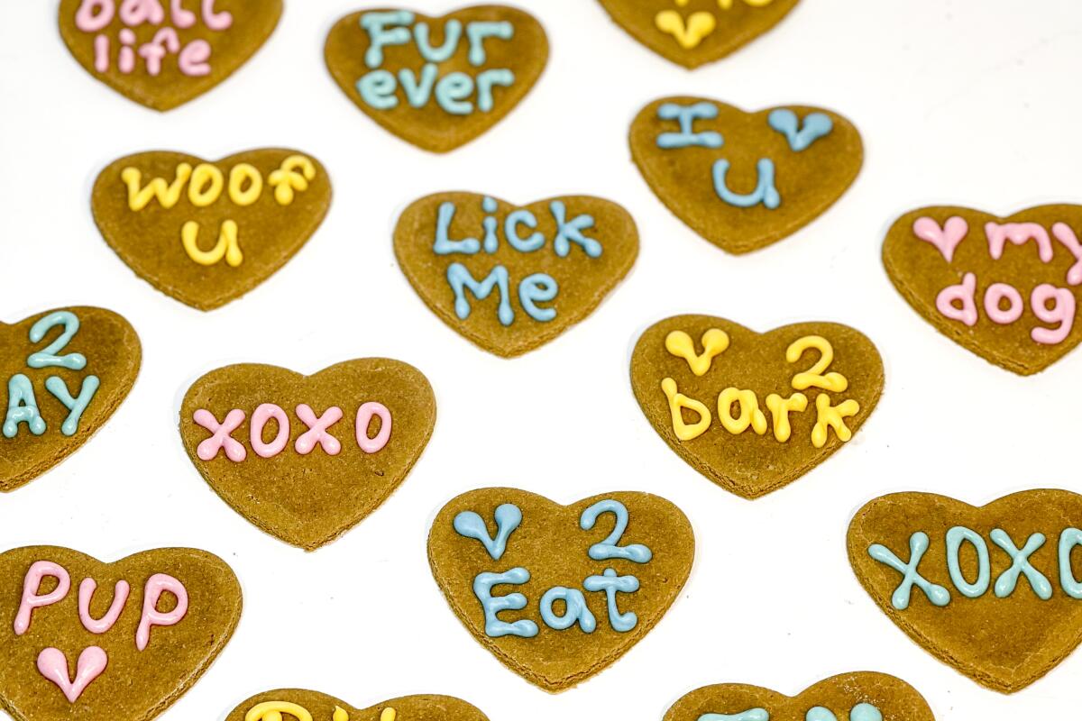 Heart-shaped cookies with words written in icing