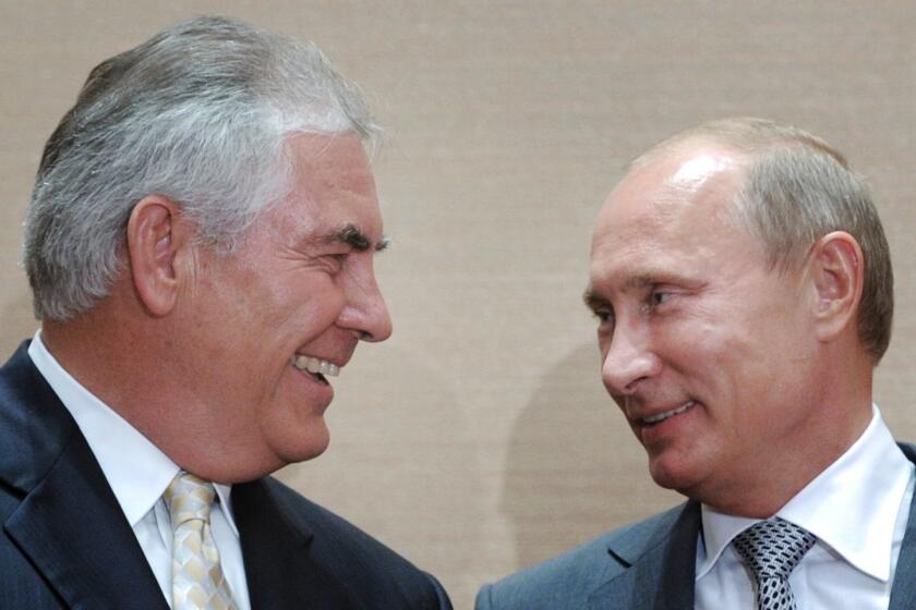 Russian Prime Minister Vladimir Putin, right, and Exxon Mobil chief executive Rex Tillerson in Sochi, Russia on Aug. 30, 2011.