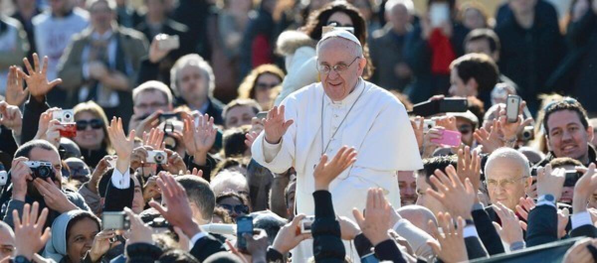 Pope Francis greets the crowd in St. Peter's Square in Vatican City before his inauguration Mass.