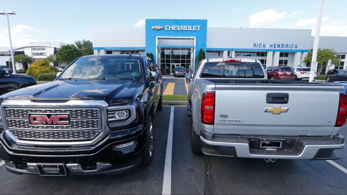 Vehicles are lined up in front of a Chevrolet dealership in Richmond, Va., on April 26.