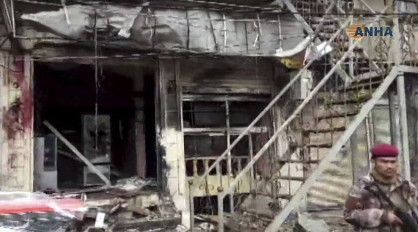 This frame grab from video provided by Hawar News, the news agency for the semi-autonomous Kurdish areas in Syria, shows a damaged restaurant where an explosion occurred in Manbij, Syria on Jan. 16.