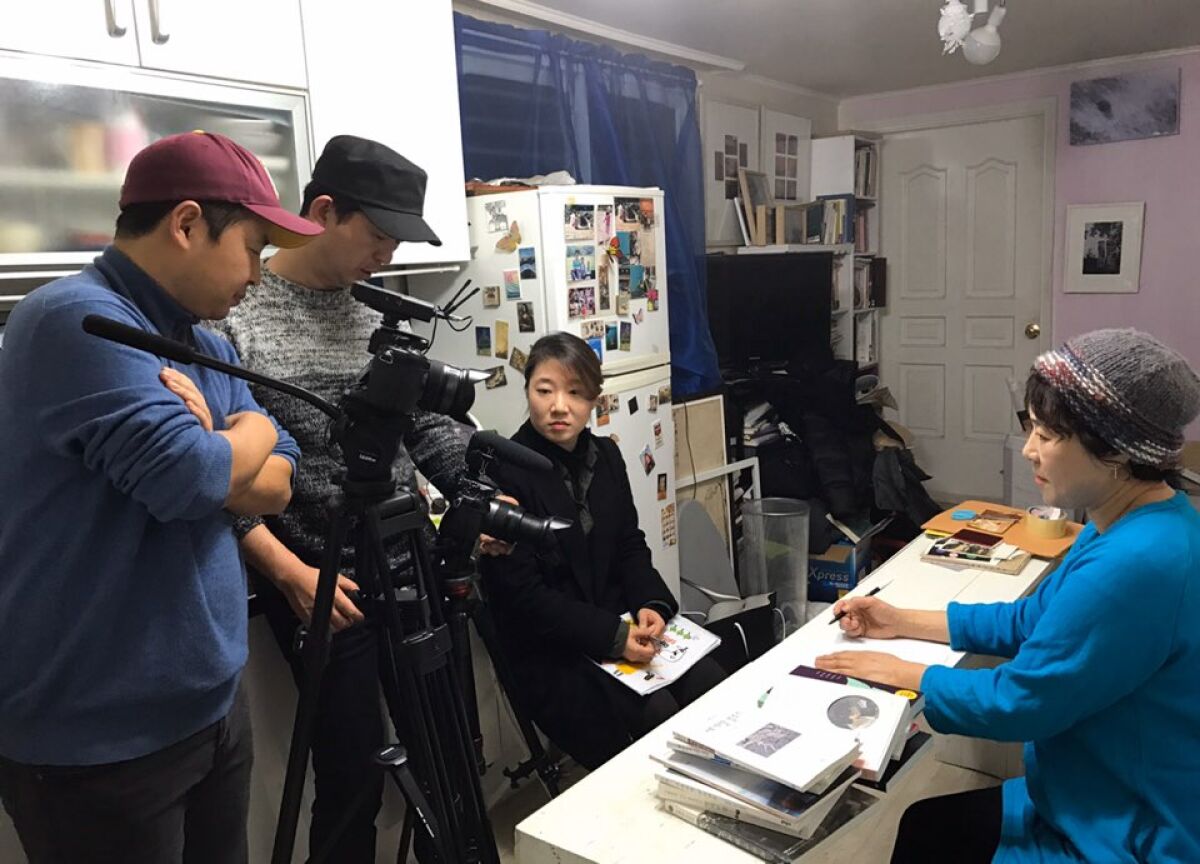 Poet Shin Hyun-rim is interviewed in her semi-basement home in central Seoul.