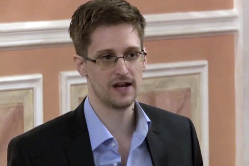 FILE - In this image made from video and released by WikiLeaks, former National Security Agency systems analyst Edward Snowden speaks in Moscow, Oct. 11, 2013. President Vladimir Putin has granted Russian citizenship to former U.S. security contractor Edward Snowden, according to a decree signed by the Russian leader on Monday Sept. 26, 2022. (AP Photo, File)