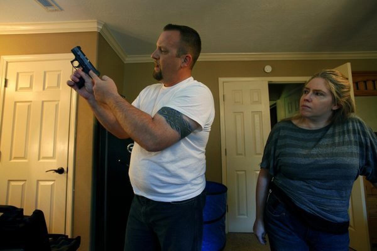 McAbee and his wife, Misty, keep their guns in a safe in their bedroom--when they aren't wearing them.