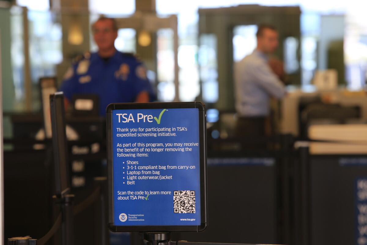 The TSA PreCheck screening line at John Wayne Airport in Santa Ana. A survey found that frequent fliers give the TSA lower marks despite an expansion of the PreCheck program.