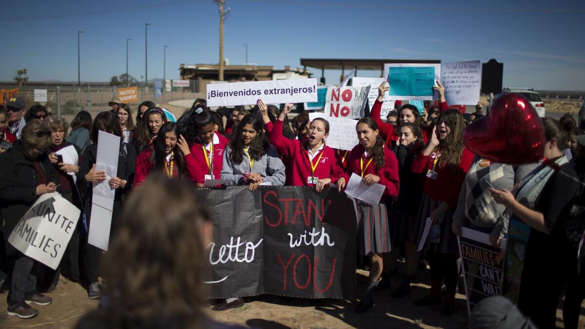Students from a local Catholic school protest outside the Tornillo detention camp holding more than 2,300 migrant teens in Tornillo, Texas, on Nov. 15, 2018.