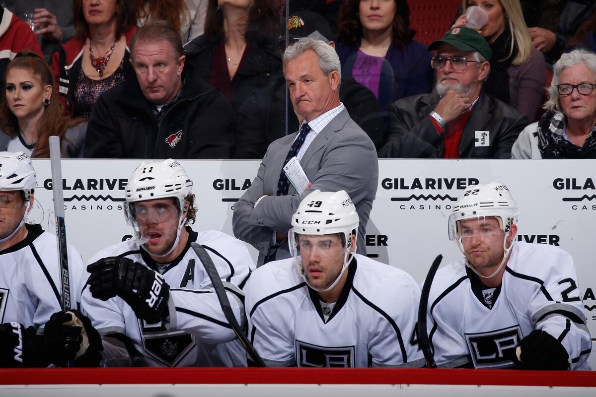 Darryl Sutter coaches the Kings during a game against the Coyotes in December 2015.