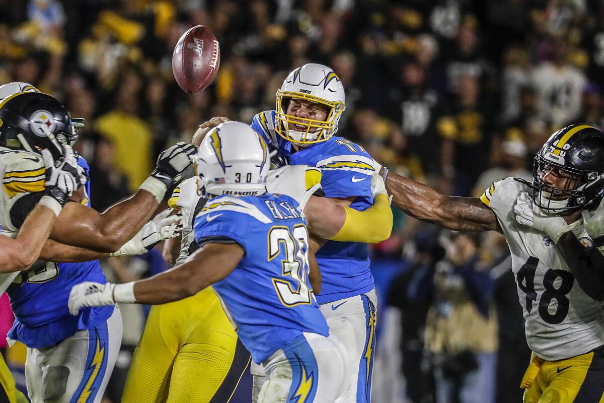 Steelers running back James Conner sprints past Chargers linebacker Jatavis Brown for a touchdown in the second quarter.