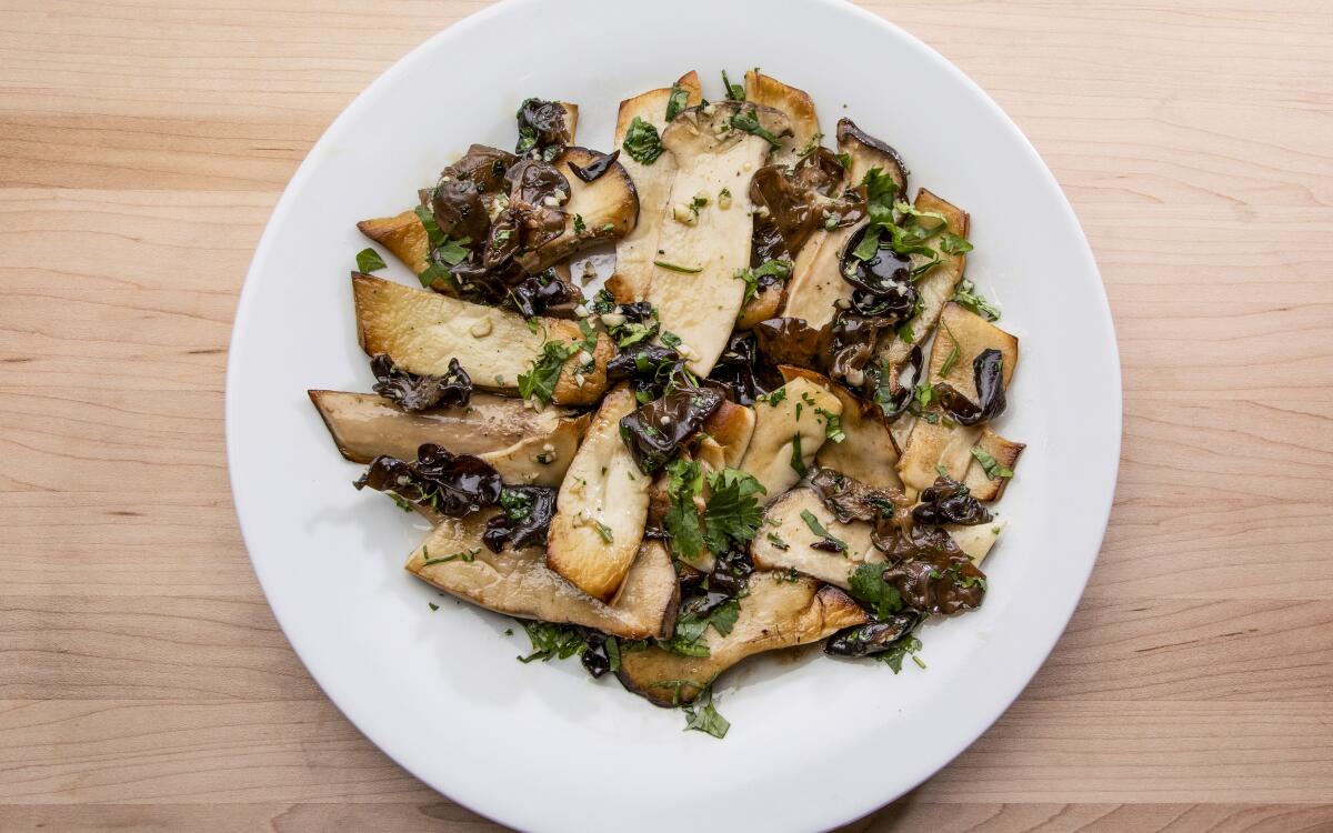 Minced cilantro and garlic add freshness to a dish of burnished, earthy mushrooms by David Tanis.