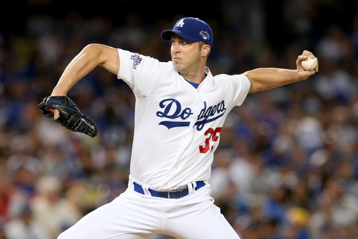 Dodgers hurler Chris Capuano in action Sunday during the fourth inning of the 13-6 win over the Atlanta Braves in Game 3 of the National League division series.