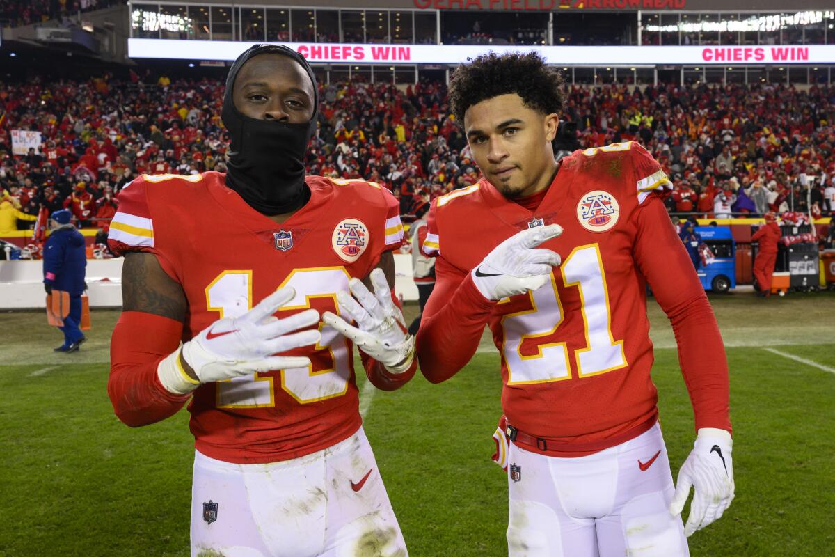 Chiefs safety Nazeeh Johnson (13) and cornerback Trent McDuffie (21) celebrate their playoff win over the Jaguars. 