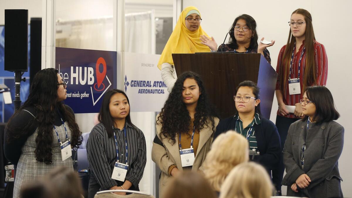 Local high school girls completed "Girls Take Flight," an Elementary Institute of Science drone program that taught them to become FAA certified pilots. Here, they speak Friday at the American Institute of Aeronautics and Astronautics' Scitech Forum at the Manchester Grand Hyatt.