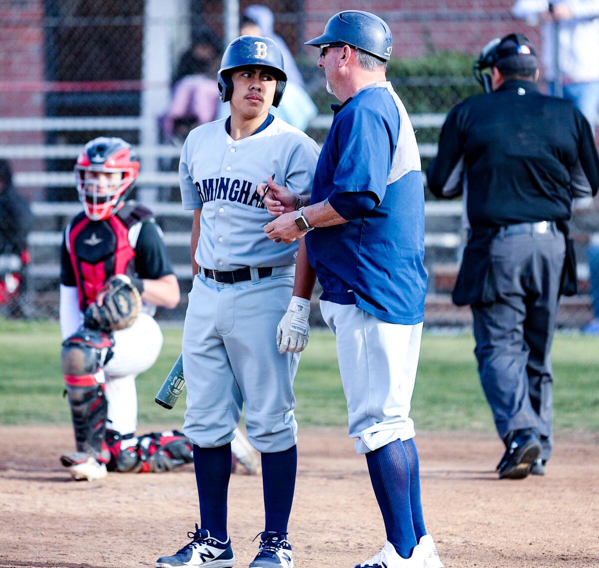 Coach Matt Mowry talks with David Castaneda.