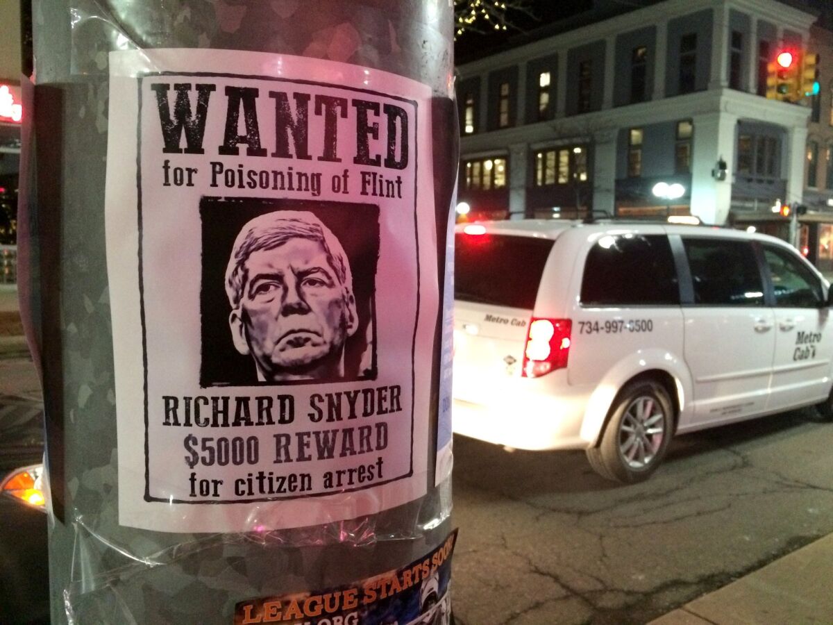 Not the only guilty party: Poster offers a $5,000 reward for "citizen arrest" of Michigan Republican Gov. Rick Snyder, whose officials played a key role in the Flint water crisis. But where were the scientists?