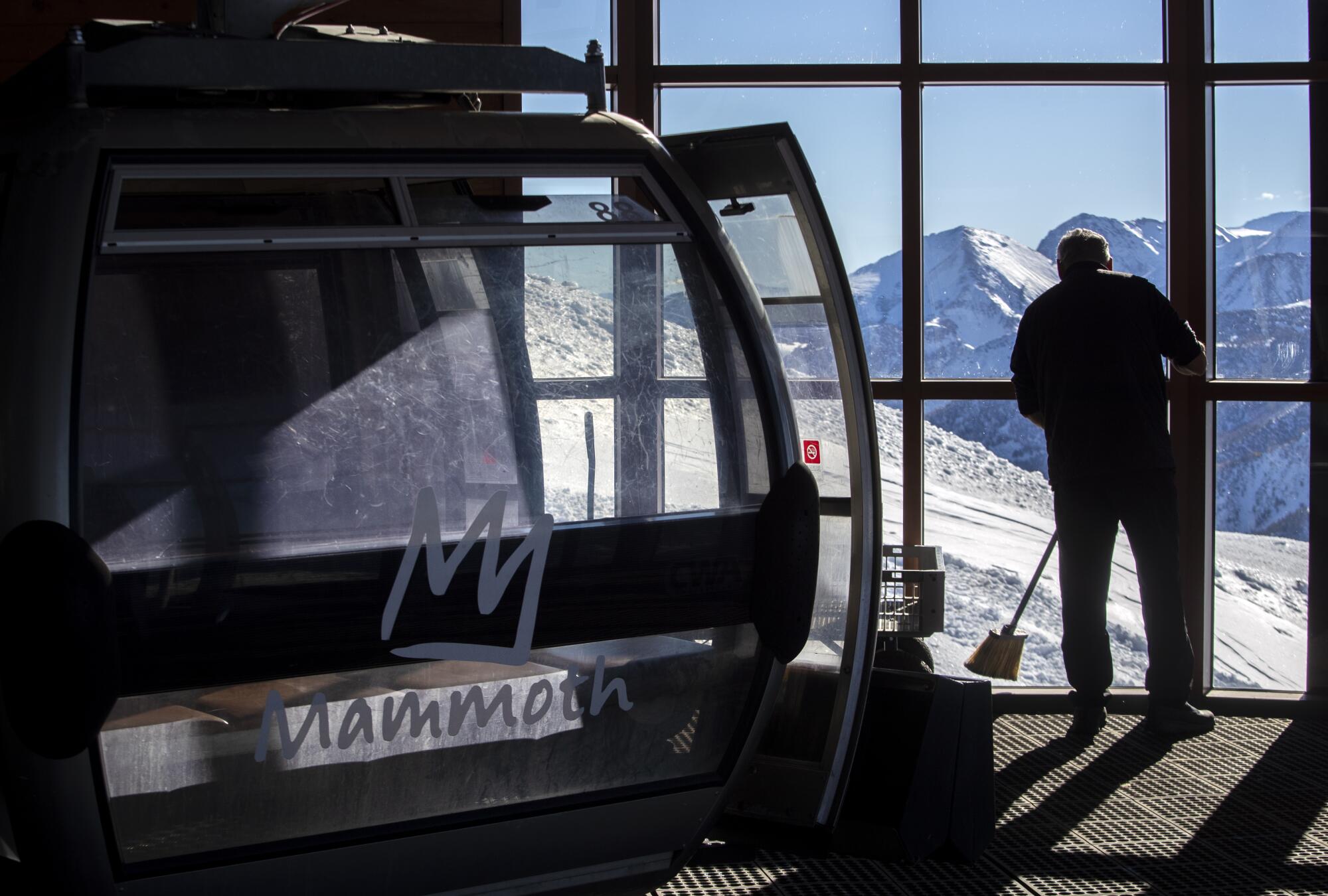 Vincent Valencia sweeps up around the Panorama Gondola summit station.