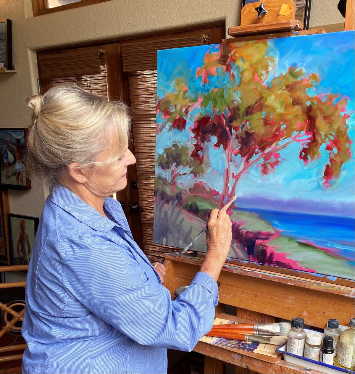 Dot Renshaw paints from her 1920 Moorish-style home in Pacific Beach.