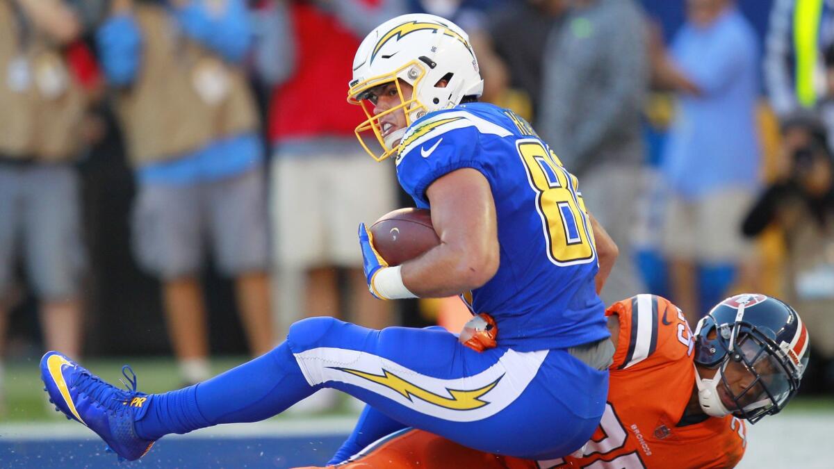 Chargers tight end Hunter Henry catches a touchdown over Denver's Chris Harris Jr. on Oct. 13, 2016.
