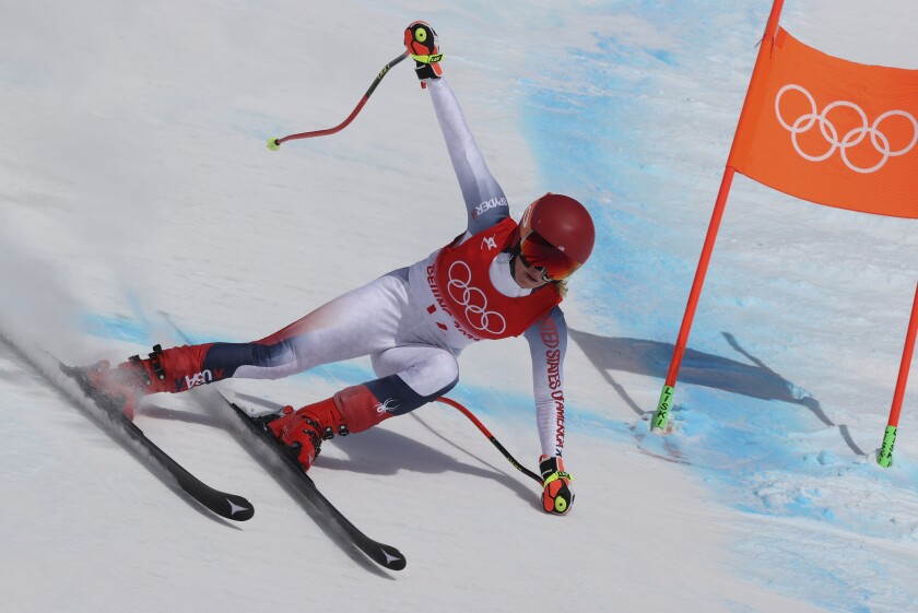 Mikaela Shiffrin, of the United States makes a turn during the women's downhill at the 2022 Winter Olympics, Tuesday, Feb. 15, 2022, in the Yanqing district of Beijing. (AP Photo/Alessandro Trovati)