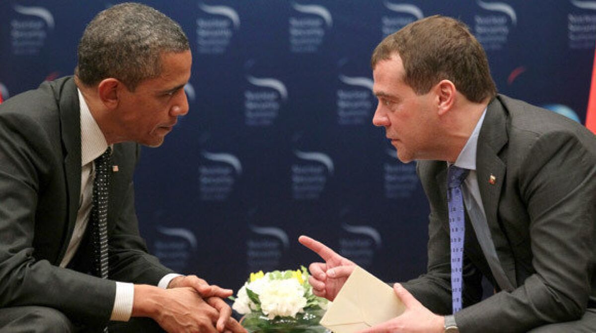 President Obama, left, speaks with Russia's President Dmitriy Medvedev, right, during their bilateral meeting on the sidelines of the 2012 Seoul Nuclear Security Summit.