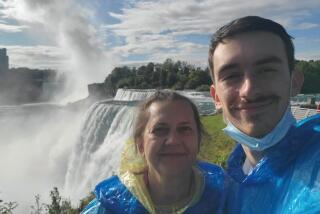 West Hollywood native Max Buydakov, right, stands next to his mother, Larisa Pereshivaylova, at Niagara Falls in August.