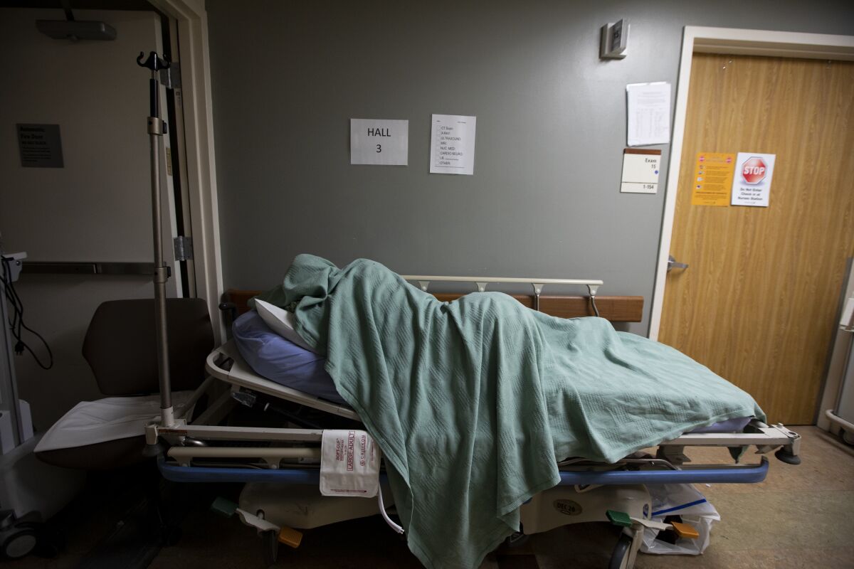 A patient rests in a hallway of Providence Saint Mary Medical Center on Dec. 22.