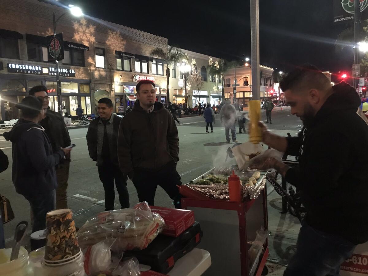 Gabriel Garcia of Pasadena has sold hot dogs on New Year’s Eve for the last for years.