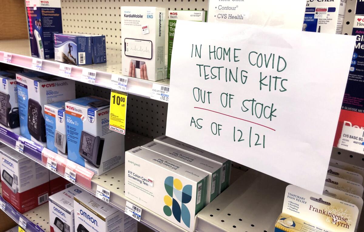 A sign indicates no COVID in-home testing kets were available at this Torrance CVS on Tuesday.