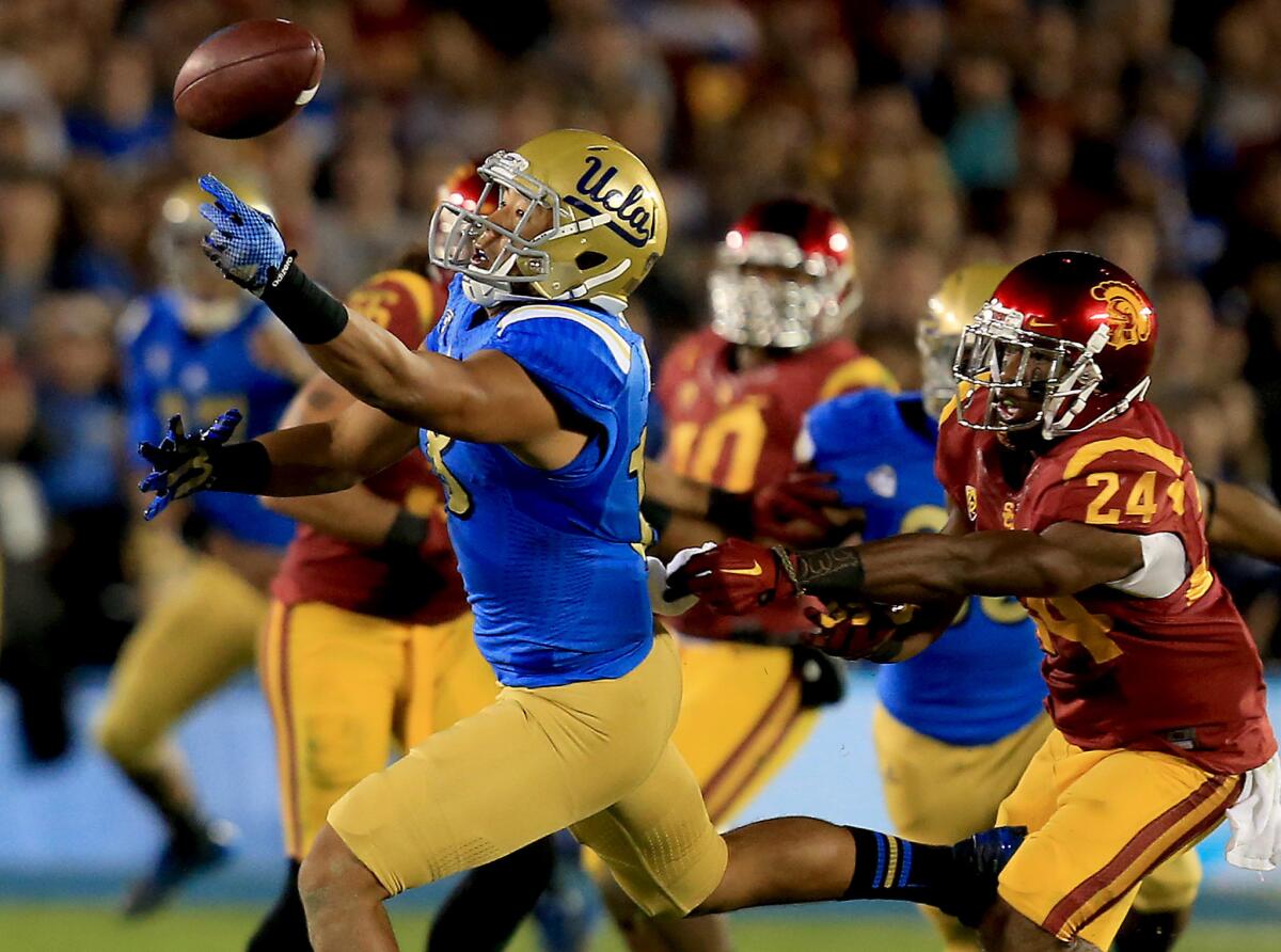 UCLA receiver Thomas Duarte can't reach a pass while defended by USC safety John Plattenburg during last season's rivalry game.