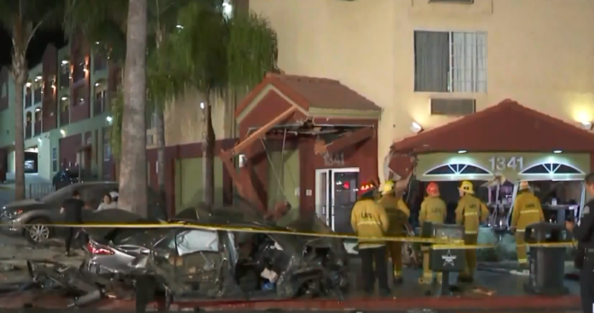 Two people were seriously injured when a car slammed into a Super 8 motel on Sunset Boulevard in Echo Park, police said.