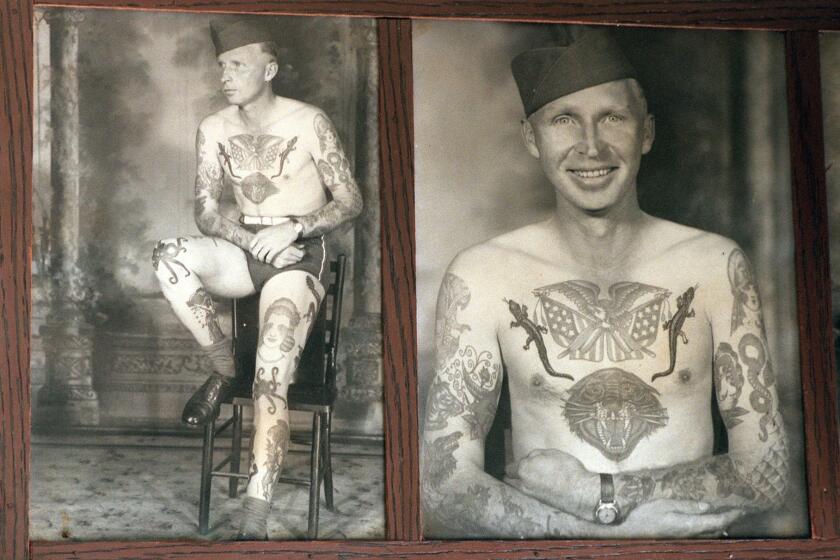Bert Grimm's Tattoo Studio in Long Beach is the oldest tattoo shop in the nation. To go with story about the rise and fall of the Navy, once it's biggest customer. Old photograph of service man who had tattoos done at Grimm's. Photo taken in 1940 1950 according to manager, Rick Walters.