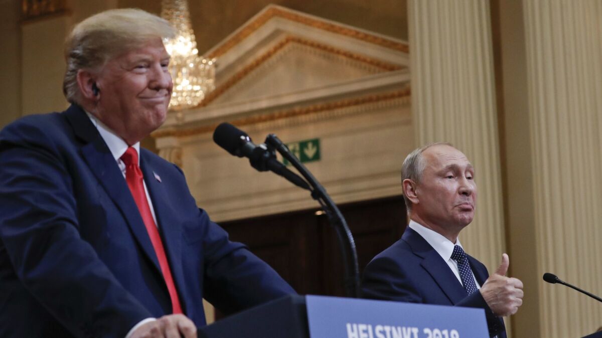 President Trump and Russian President Vladimir Putin, right, give a joint news conference at the Presidential Palace in Helsinki, Finland, on July 16.