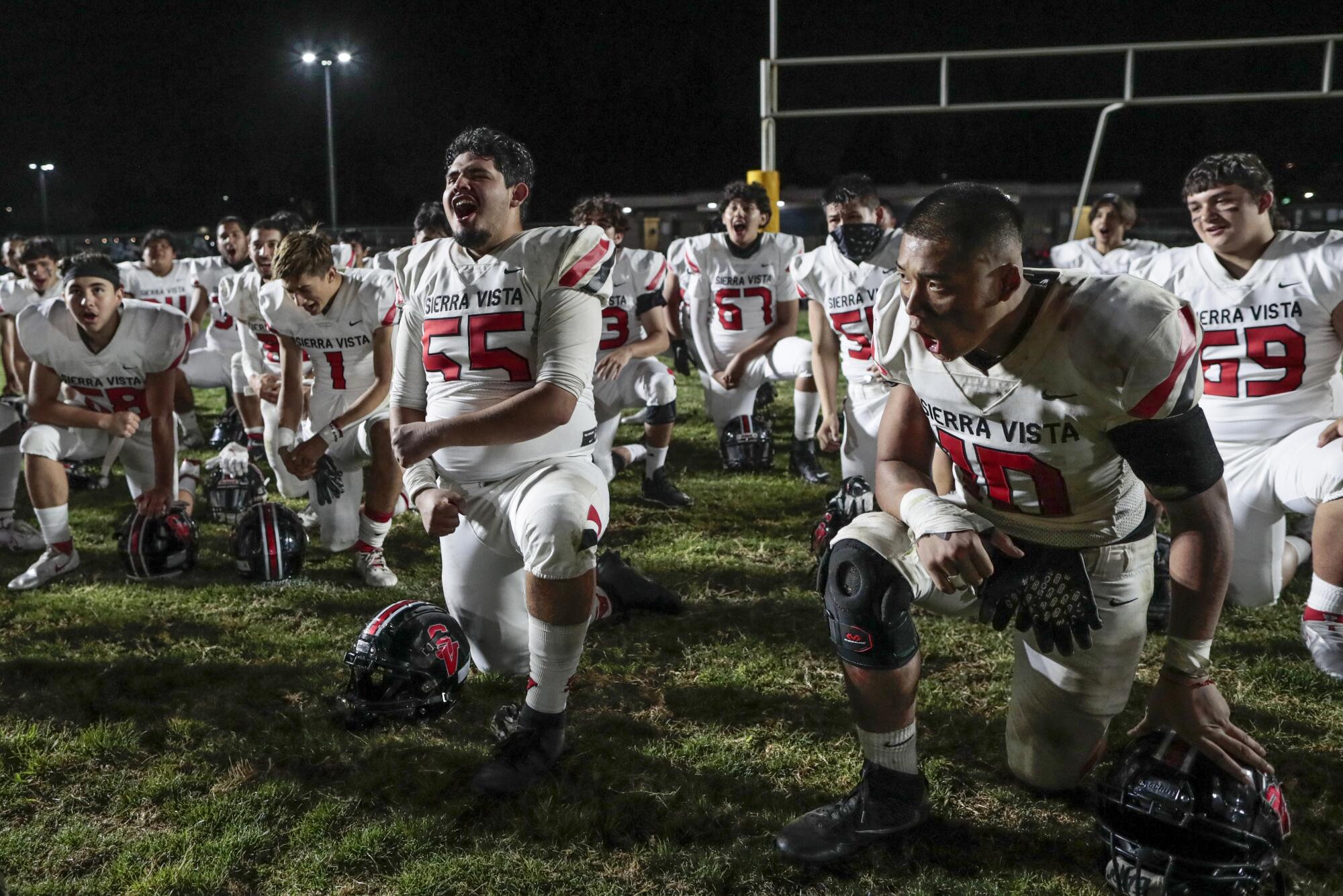 Cesar Martinez and Johnny Sen celebrate a win over Cerritos High.