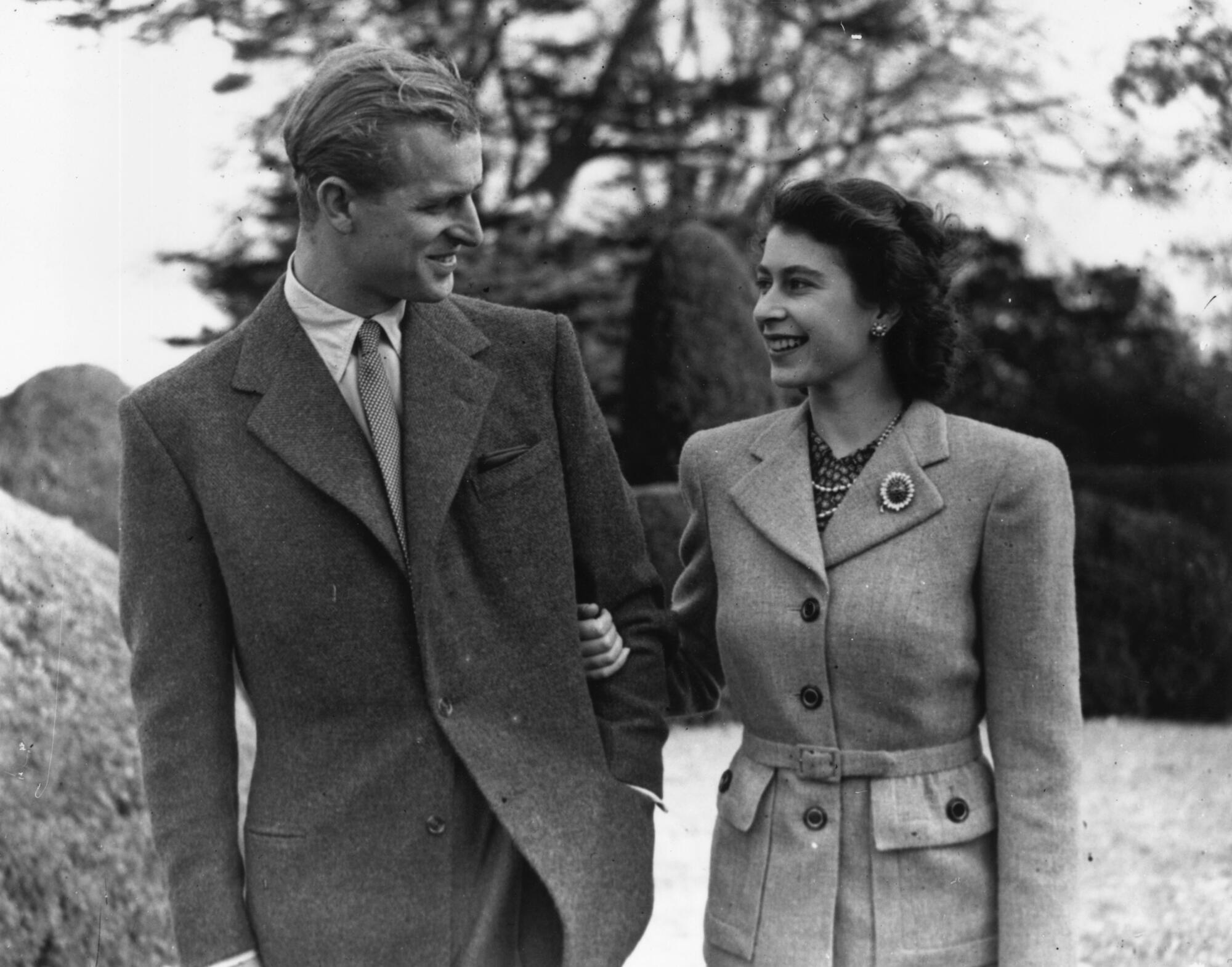 Princess Elizabeth and Prince Philip enjoying a walk during their honeymoon.