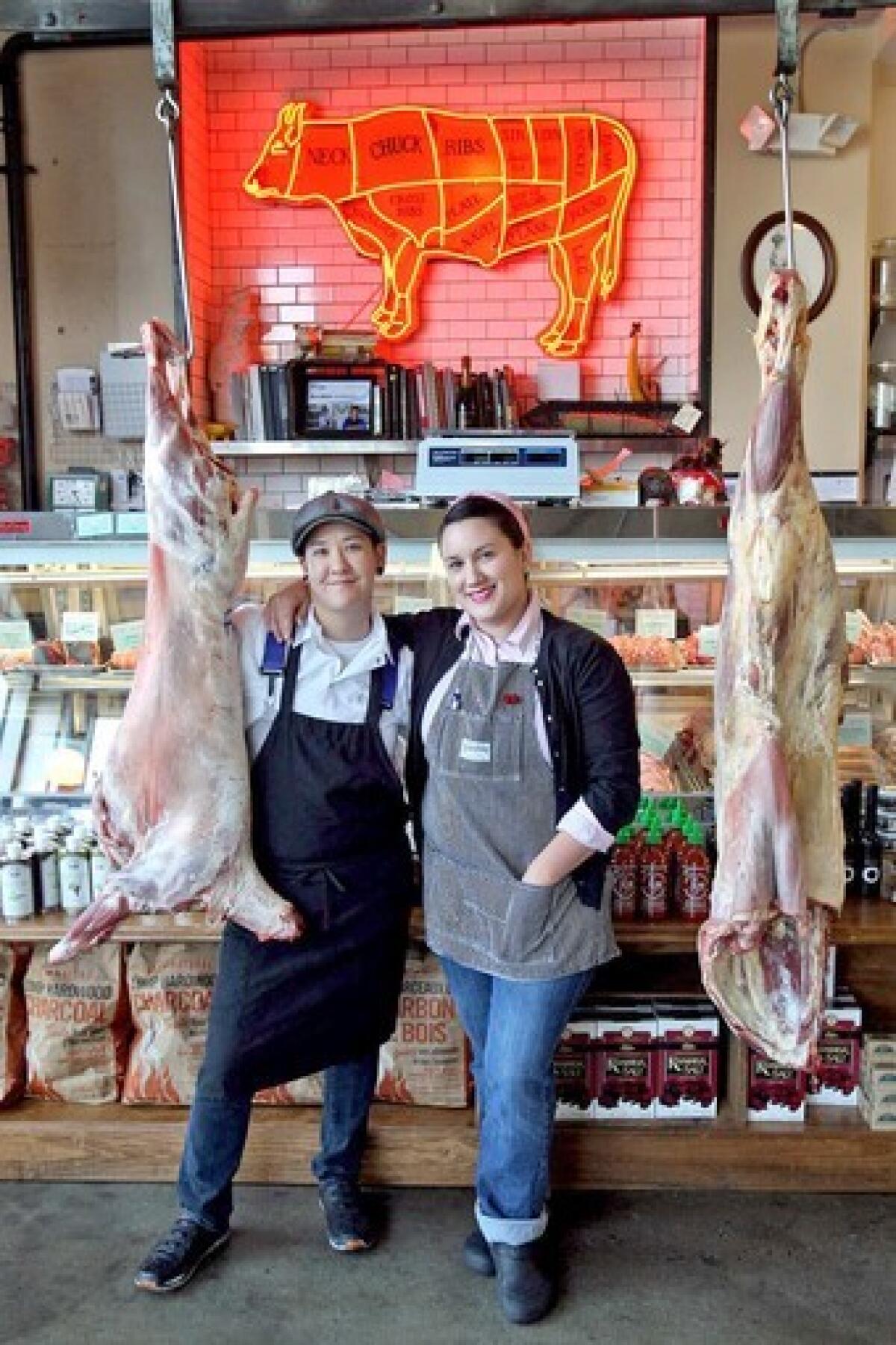 Erika Nakamura, left, and Amelia Posada show off their lamb and beef at Lindy & Grundy in Los Angeles.