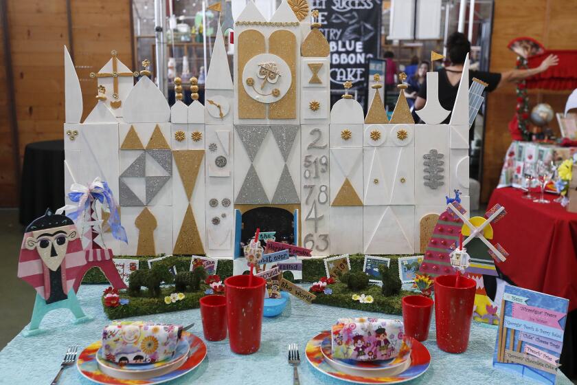 A travel-themed table by Christel Schoenfelder is displayed during the first round of the table-setting competition at the Orange County Fair.