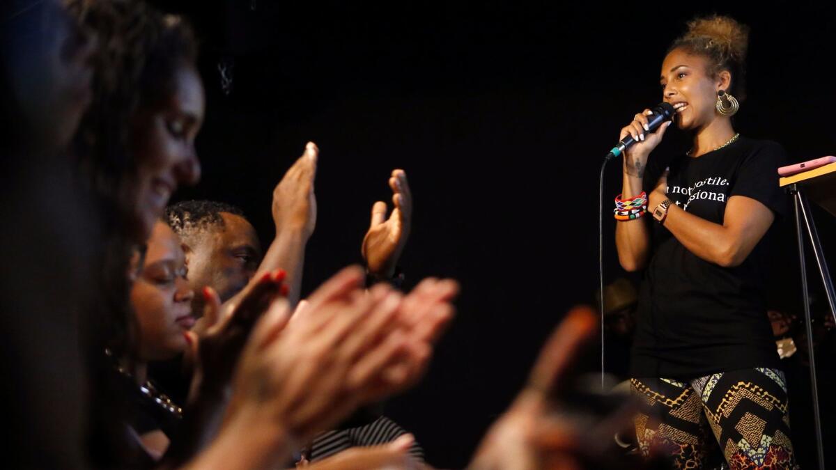 Guests clap as comedian Amanda Seales hosts a comedy game show at the Nerdmelt comic bookstore in Hollywood in July 2017.